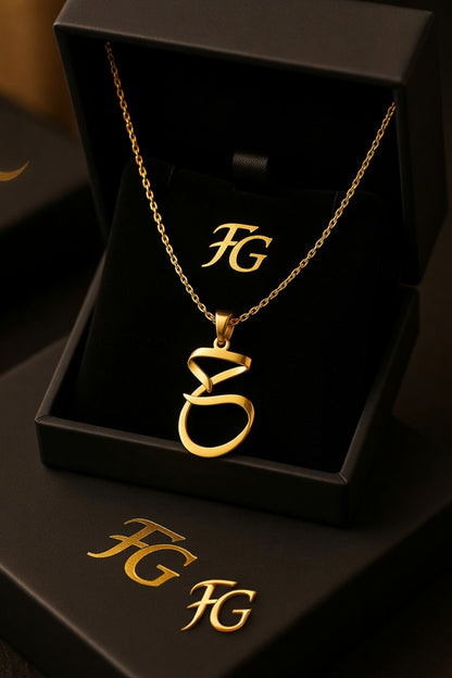 A necklace with a unique, modern Arabic letter pendant.